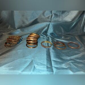 Set of (5) different type of gold toned bangles